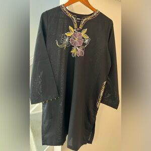 Pakistani two piece kurta and trouser dress.